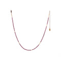 The Oso Necklace features hand-cut gemstones and recycled brass bars of varied lengths