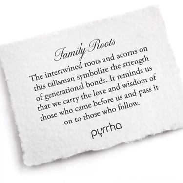 A Pyrrha Note describing the Family Roots talisman. It reads, "The intertwined roots and acorns on this talisman symbolize the strength of generational bonds. It reminds us that we carry the love and wisdom of those who came before us and pass it on to those who follow."