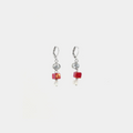 Short silver earrings featuring pewter accents, colorful red glass beads, and a freshwater pearl
