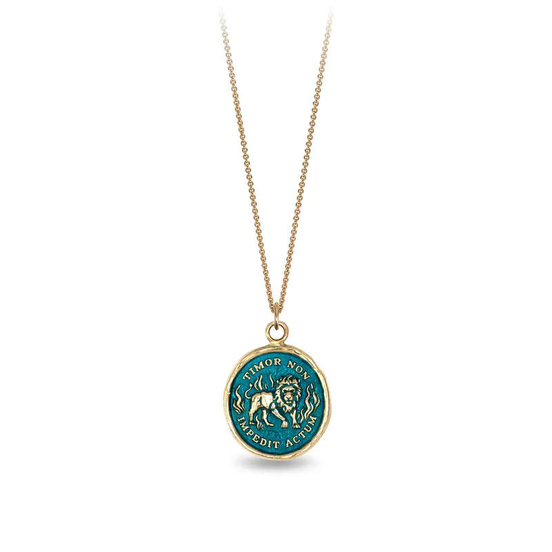 14k Yellow gold talisman necklace with a bright Blue background depicting a lion standing in flames with the words "Timor Non Impedit Actum" written around the lion