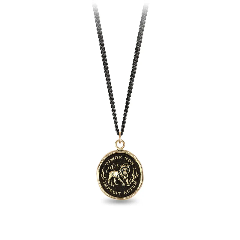 Black sterling silver necklace with a 14k yellow gold talisman depicting a Lion standing around flames with the words "Timor Non Impedit Actum" wriiten around the lion