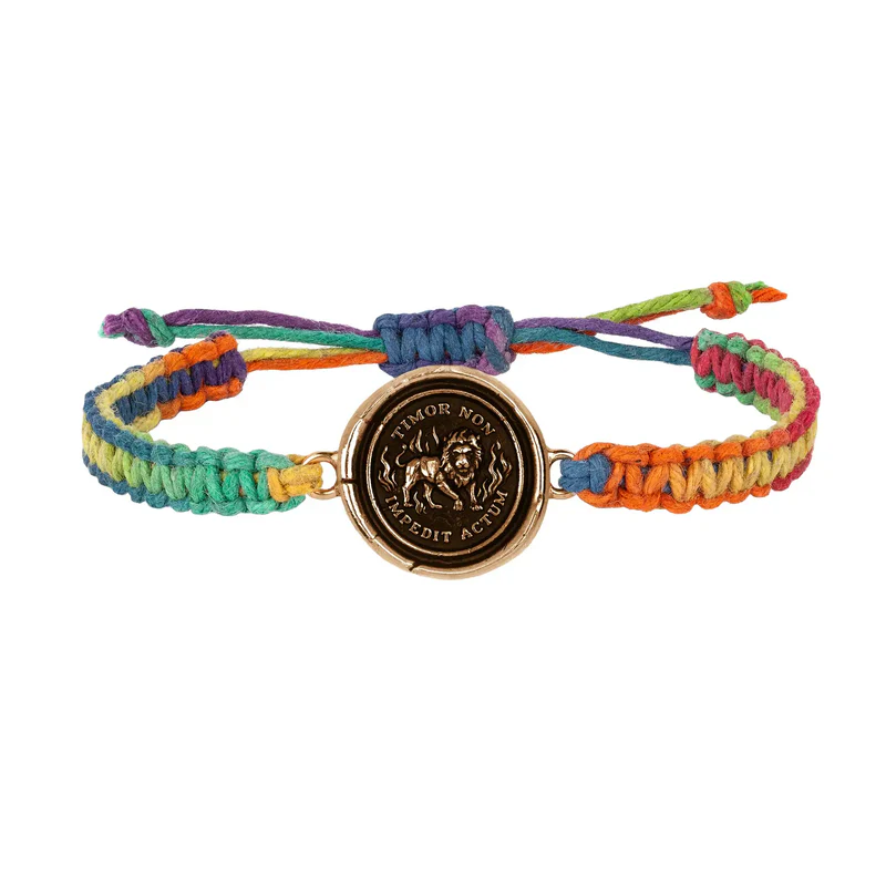 Rainbow braided Bracelet with a Bronze talisman depicting a lion surrounded by flames and including the words "Timor Non Impedit Actum"