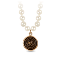 Bronze Talisman Necklace With Ivory freshwater Pearls, and a talisman depicting a Lion surrounded by flames with the words "Timor Non Impedit Actum" written around it