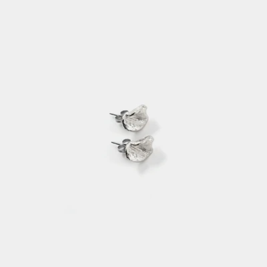 Sivler pewter stud earrings sculpted into a petal shape