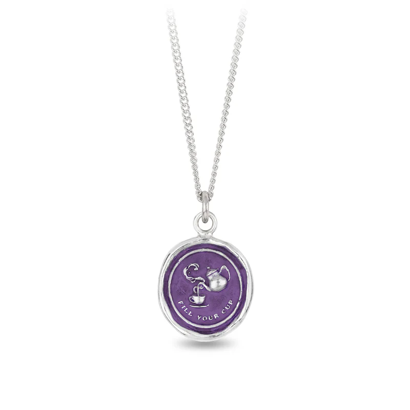 Sterling Silver Necklace with a violet background under a talisman depicting A teapot pouring into a teacup, with the words "Fill your cup" written underneath