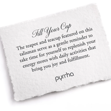 A Pyrrha Note describing the Fill Your Cup Talisman. It reads, "The teapot and teacup featured on this talisman serve as a gentle reminder to take time for yourself to replenish your energy stores with daily activities that bring you joy and fulfillment."