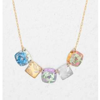 Niobum Necklace with 5 different coloured pendants strung together (left to right: Blue, orange, purple/green, White, Green and orange)