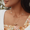 Gold Plated Silver Chain Necklace  with flowers throughout and a bee towards the center | On Model