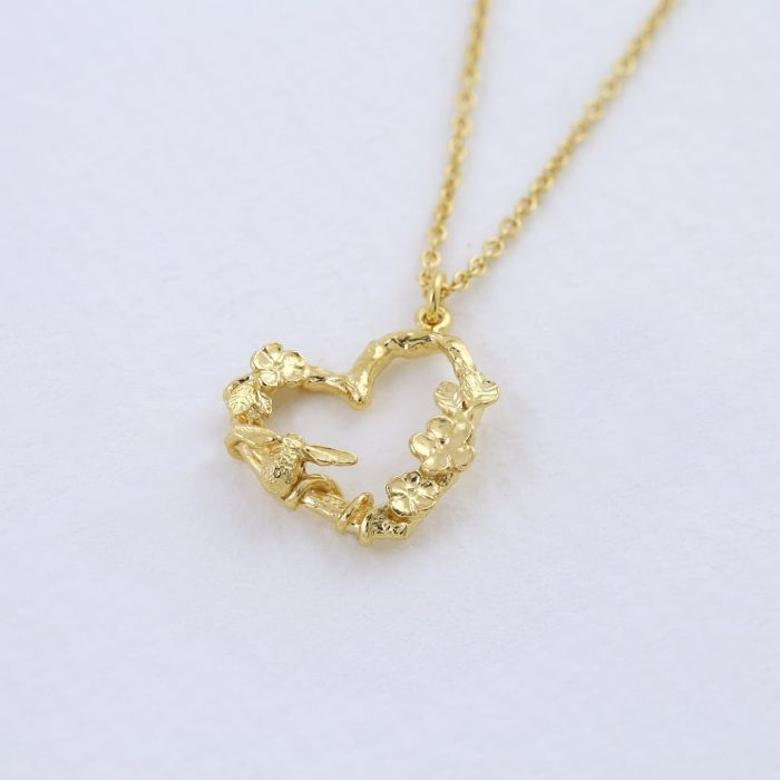 Gold Plated silver necklace with a heart pendant arranged with gold flowers
