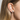 Sterling silver small flower studs with sterling silver posts  | on model