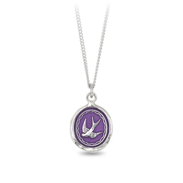 Sterling Silver Necklace with a violet background under a talisman depicting a flying swallow bird