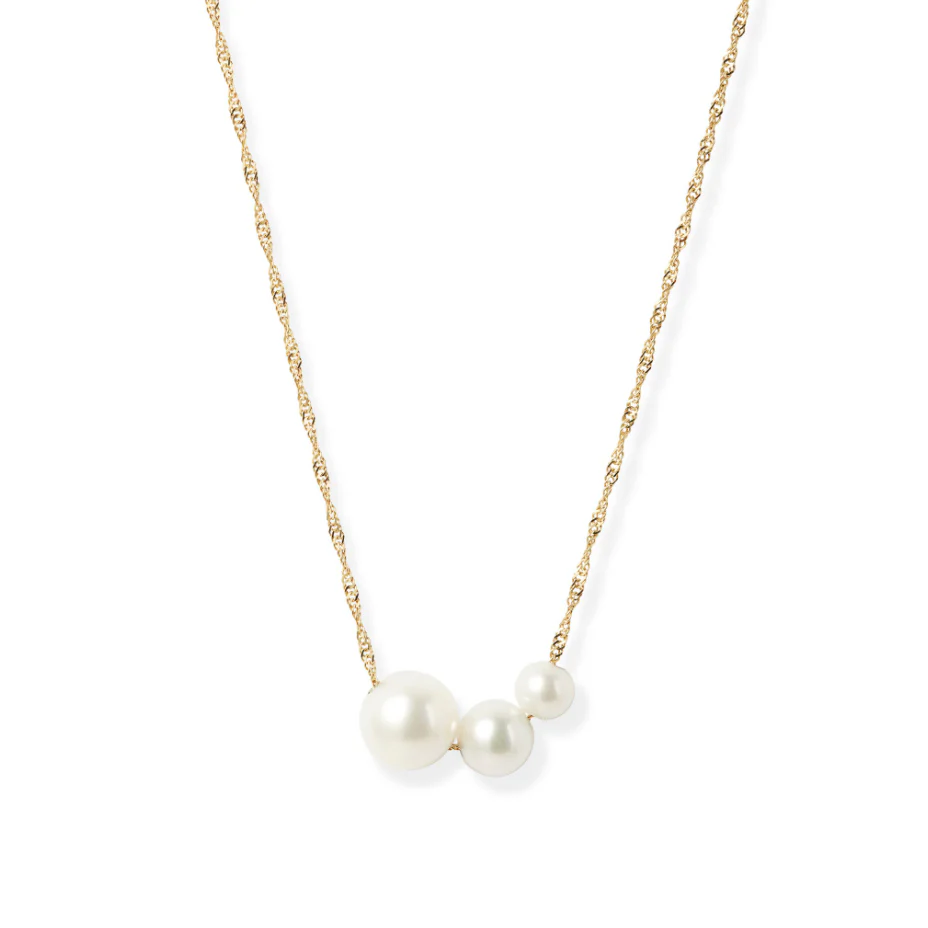 Handcrafted from 14k-karat gold, this delicate necklace is anchored with three luminous pearls in gradual sizes