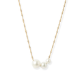 Handcrafted from 14k-karat gold, this delicate necklace is anchored with three luminous pearls in gradual sizes