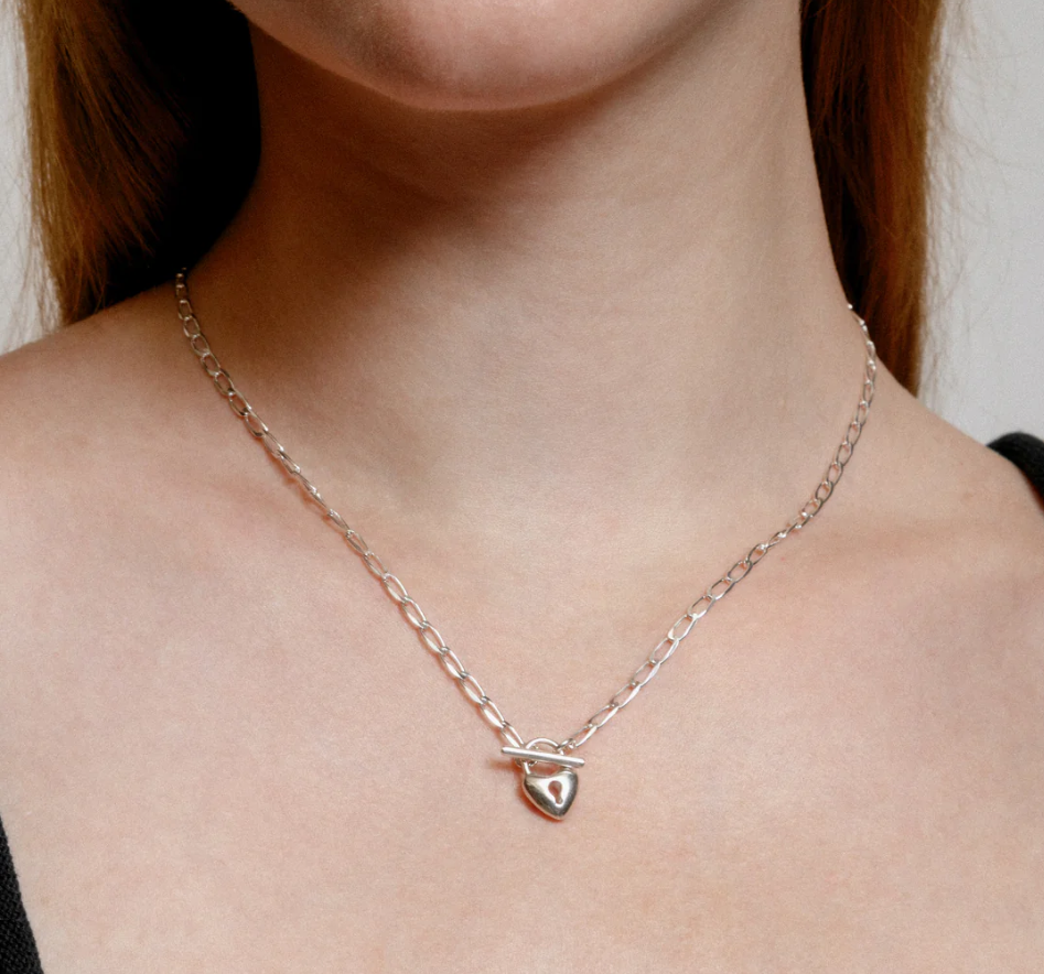 Sterling silver heart lock toggle pendant  on a Sterling silver elongated curb chain | on model