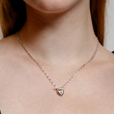 Sterling silver heart lock toggle pendant  on a Sterling silver elongated curb chain | on model