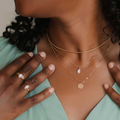 14k Yellow gold Necklace featuring an oval design with a large heritage opal set in the middle | on model