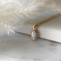 14k Yellow gold Necklace featuring an oval design with a large heritage opal set in the middle