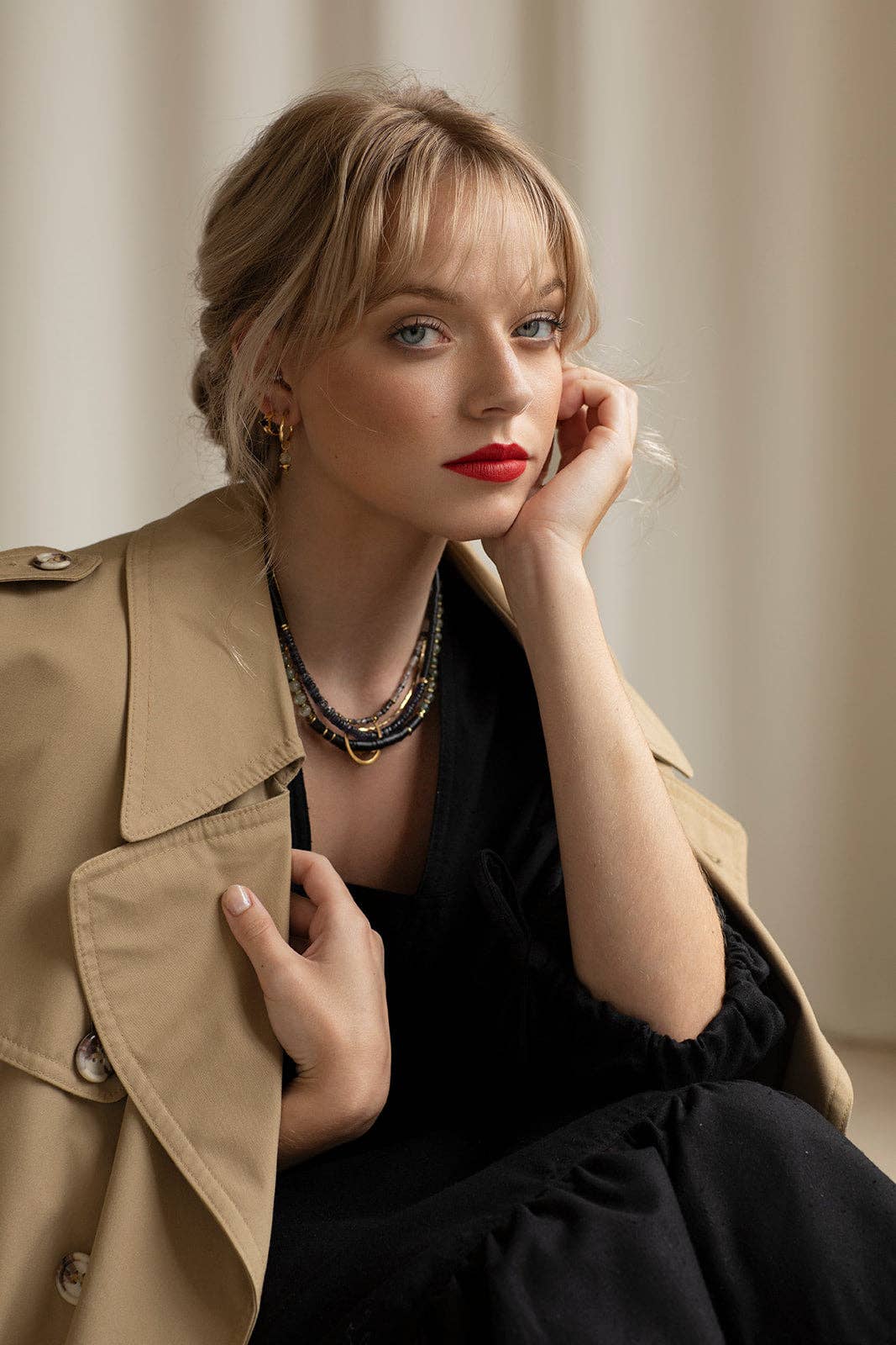 Hermona Necklace and its multicoloured palette of Prehnite, Iolite, Tourmilated Quartz and black fair-trade vinyl, folded through a vintage brass horseshoe pendant and accented with vintage brass chains | on model