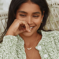 Gold Plated Silver In Line necklace with gold flowers with white petals | On Model