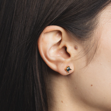 14k Gold plated brass studs with genuine blue topaz gemstones and gold vermeil posts | on model