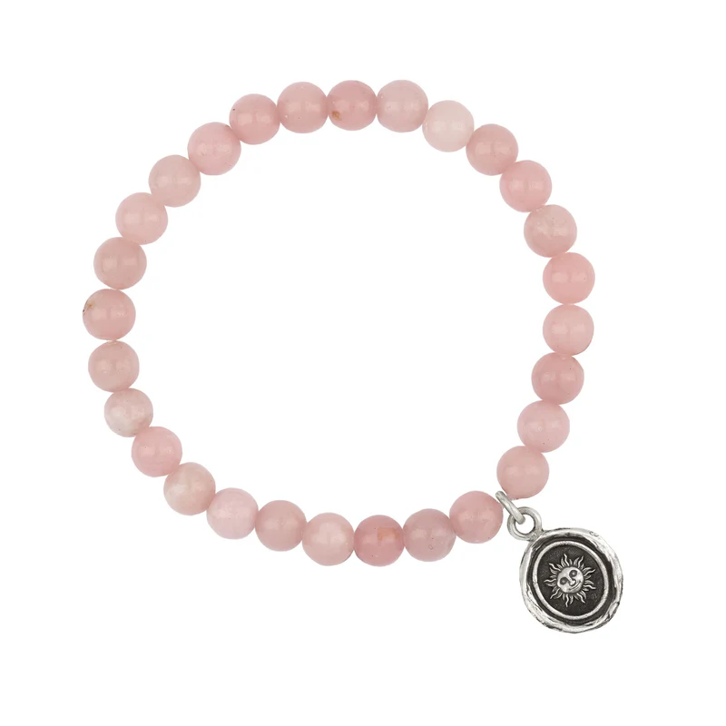 Bracelet made from Pink Opal beads, with a Sterling Silver Talisman depicting The sun with a face on it