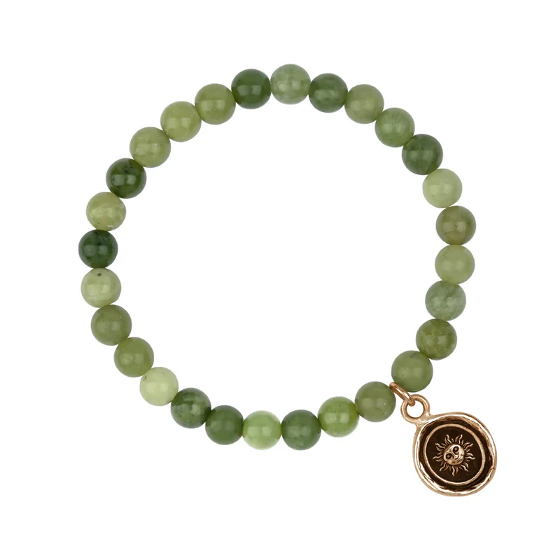 Bracelet made from Green Jade beads, with a Bronze Talisman depicting The sun with a face on it