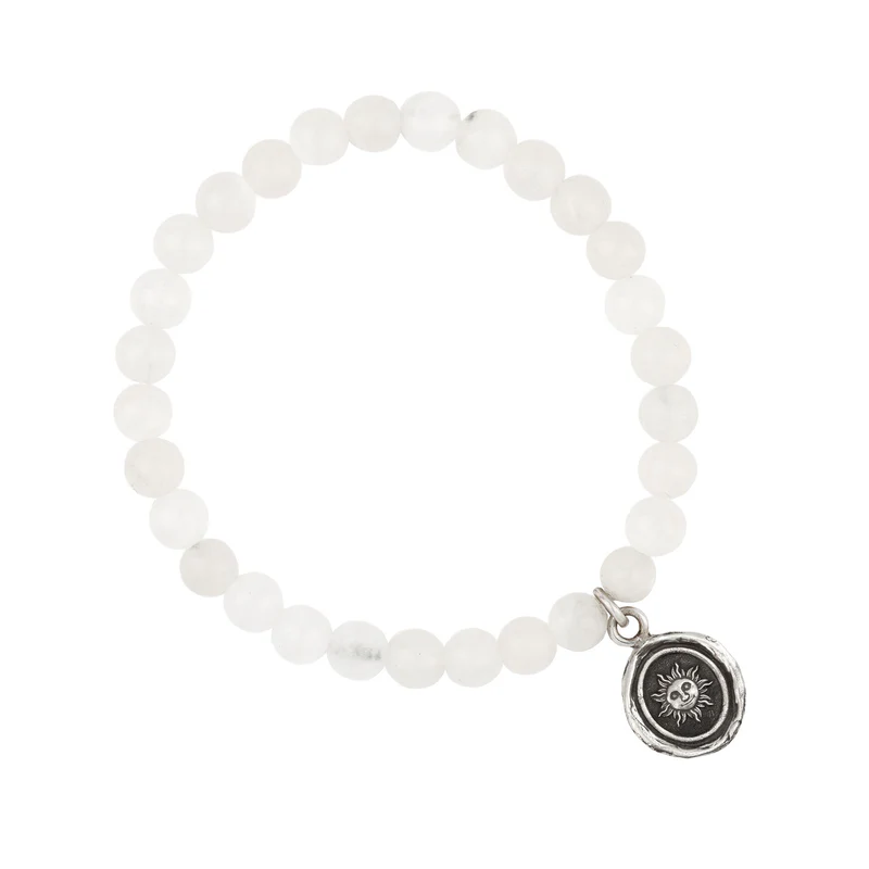 Bracelet made from White Jade beads, with a Sterling Silver Talisman depicting The sun with a face on it