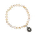 Bracelet made from Rutilated Quartz beads, with a Sterling Silver Talisman depicting The sun with a face on it
