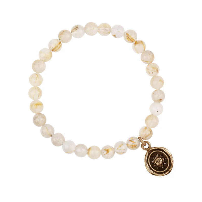 Bracelet made from Rutilated Quartz beads, with a Bronze Talisman depicting The sun with a face on it