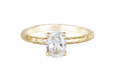 10 yellow gold solitaire ring with a .71ct diamond set in four prongs