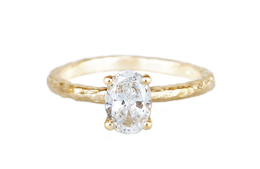 10 yellow gold solitaire ring with a .71ct diamond set in four prongs