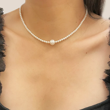 Freshwater Pearl Necklace with 3.5mm pearls on the Base chain, centered with a 8.5mm Pearl at the Base | On Model