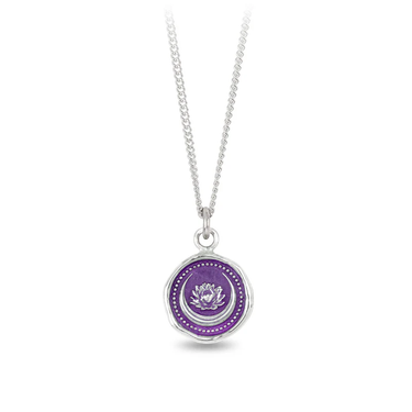 Sterling Silver talisman with a violet background under a talisman depicting a Lotus flower surrounded by a crescent moon.