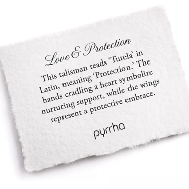 A Pyrrha note describing the Love and Protection talisman. It reads, "This talisman reads 'Tutela' in Latin, meaning 'Protection.' The hands cradling a heart symbolize nurturing support, while the wings represent a protective embrace."