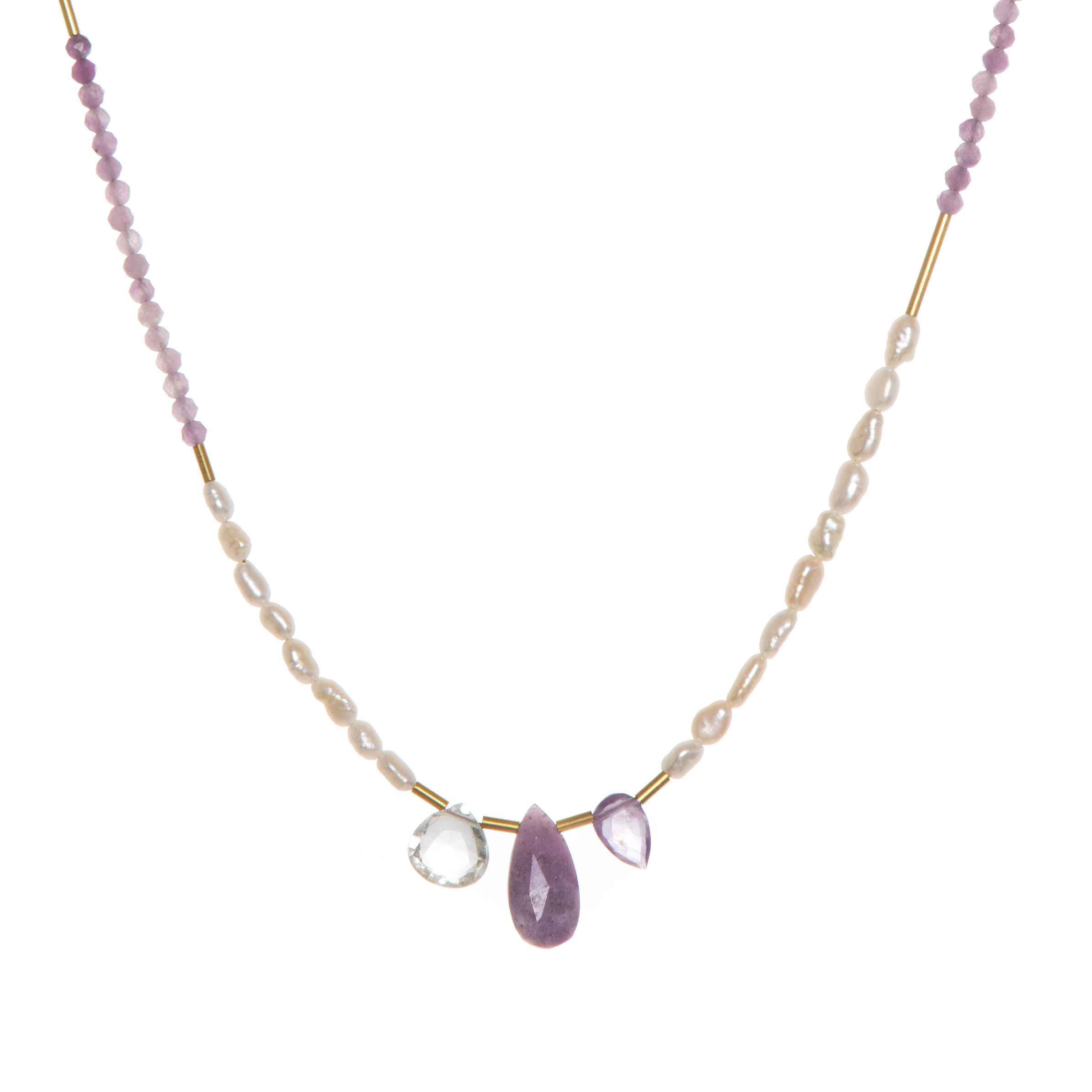 The Makani Necklace boasts hand-cut gemstones and stunning Freshwater Pearls with recycled brass accents asymmetrically spaced throughout. 