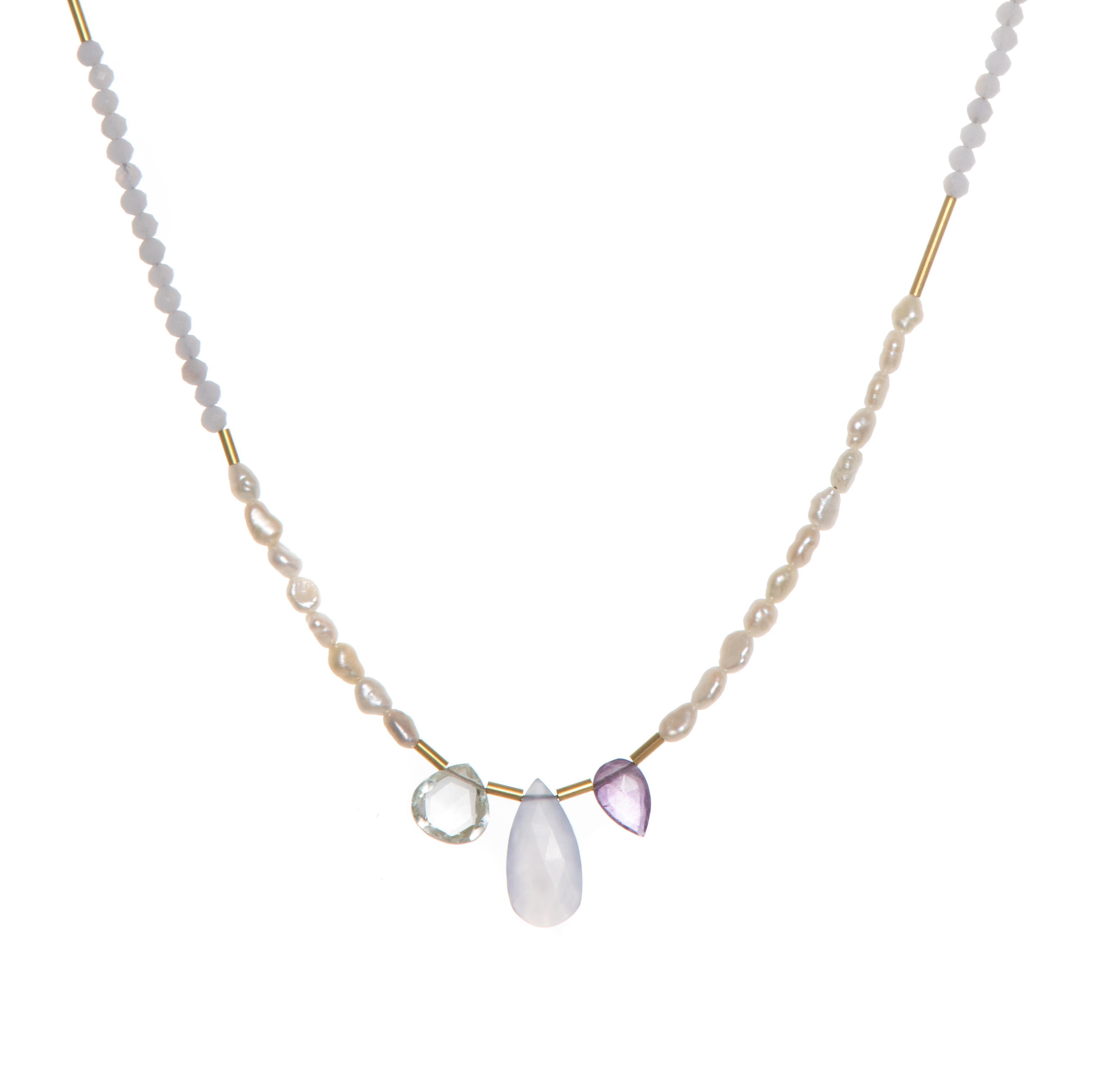The Makani Necklace boasts hand-cut gemstones and stunning Freshwater Pearls with recycled brass accents asymmetrically spaced throughout. 