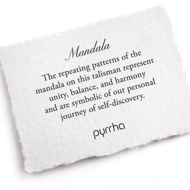 A Pyrrha note describing the mandala talisman. It reads: "The repeating patterns of the mandala on this talisman represent unity, balance, and harmony and are symbolic of our personal journey of self-discovery."