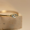 14k Yellow Gold Ring featuring a sleek marquise aquamarine gemstone