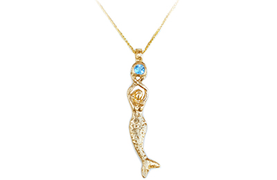 14k gold mermaid statue holding a round aquamarine necklace, on an 18″ gold wheat chain.