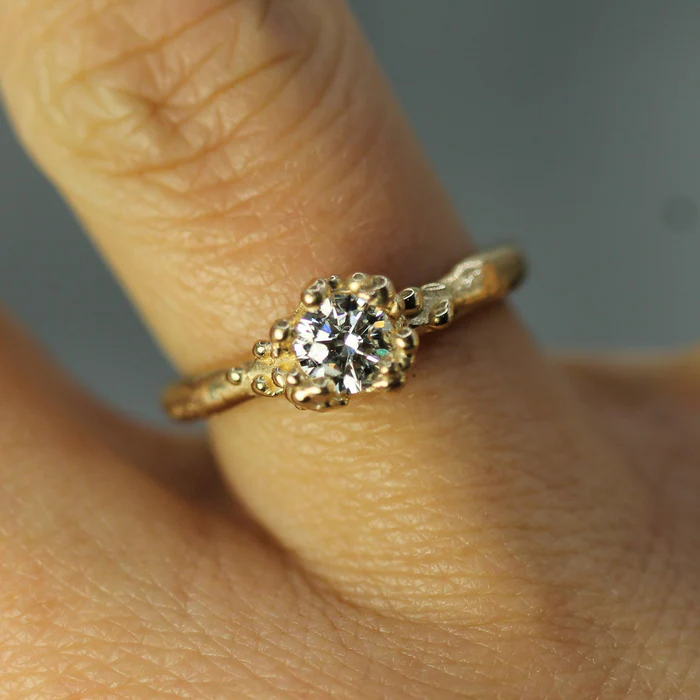 14k yellow gold Band ring with a .48ct  lab-grown diamond | on model