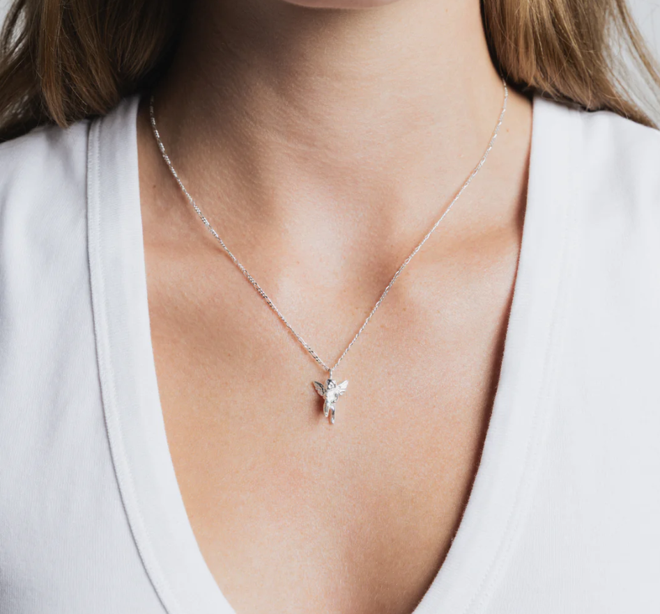 Sterling Silver Cherub pendant on a Sterling Silver figaro chain | on model