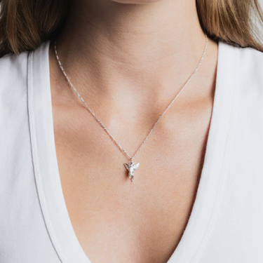 Sterling Silver Cherub pendant on a Sterling Silver figaro chain | on model