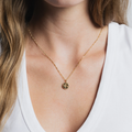 14k gold plated Brass Coin necklace with rose engraving on a Gold vermeil figaro chain | on model