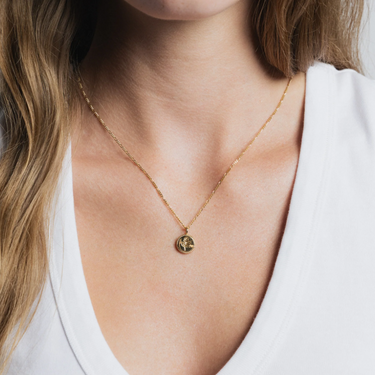 14k gold plated Brass Coin necklace with rose engraving on a Gold vermeil figaro chain | on model