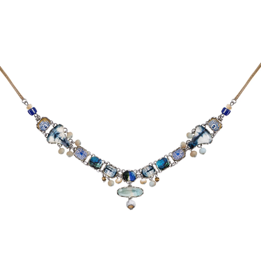 Plated Sterling Silver Necklace Featuring many variations of beads and gemstones. The predominant colours are blue white and gold, with interconnecting pendants all strung together with a large oval gemstone below the main body.