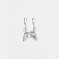 Short silver earrings adorned with a flower-shaped pewter pendant and a pearl