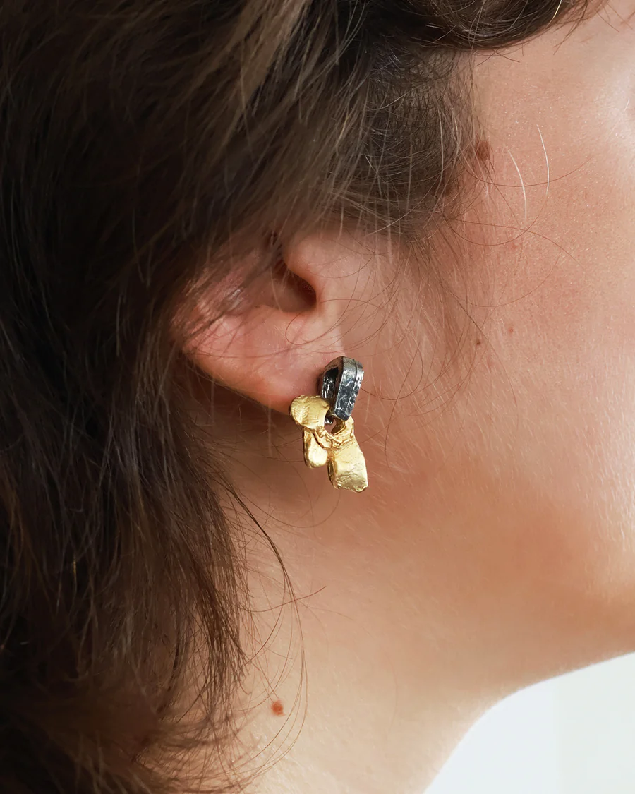 Short two-tone earrings adorned with a pewter stud and pendant | on model