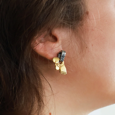 Short two-tone earrings adorned with a pewter stud and pendant | on model