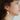 Short gold earrings with a winged pewter pendant and a cluster of colorful pearls | on model