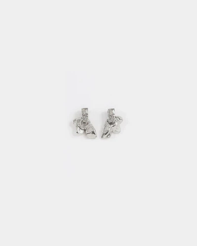 Short silver earrings adorned with a pewter stud and pendant